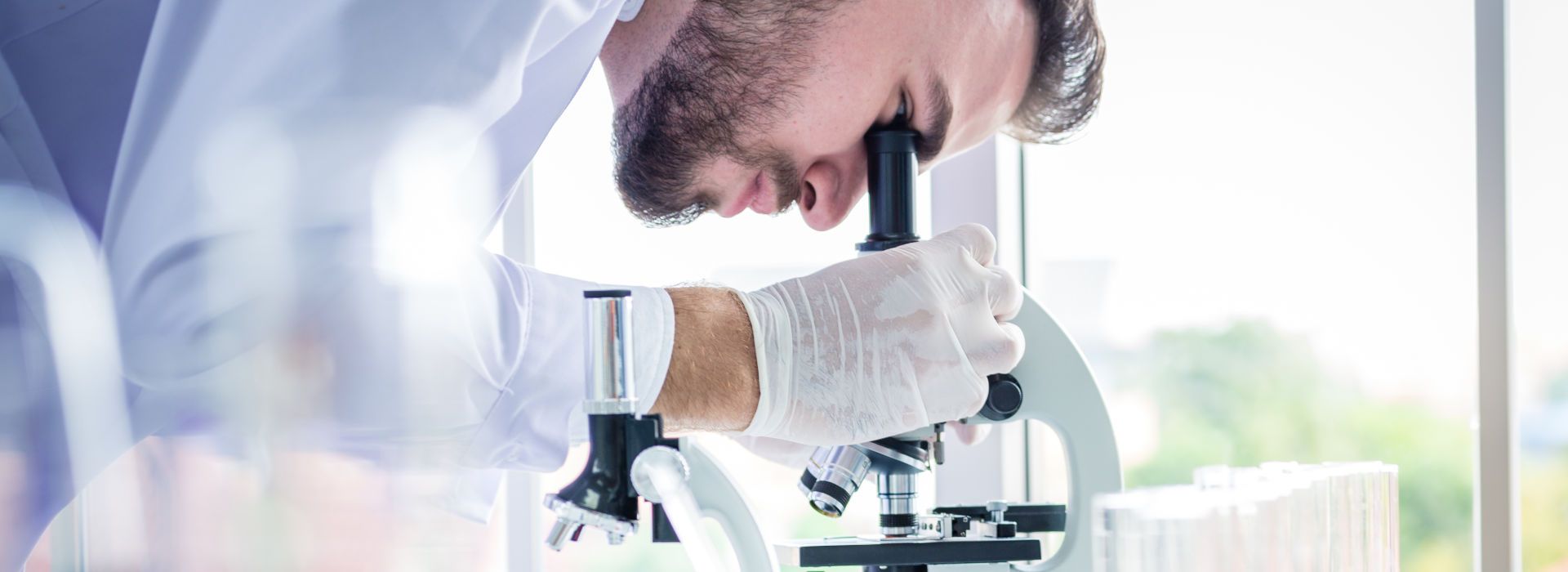 Researcher with microscope in the laboratory